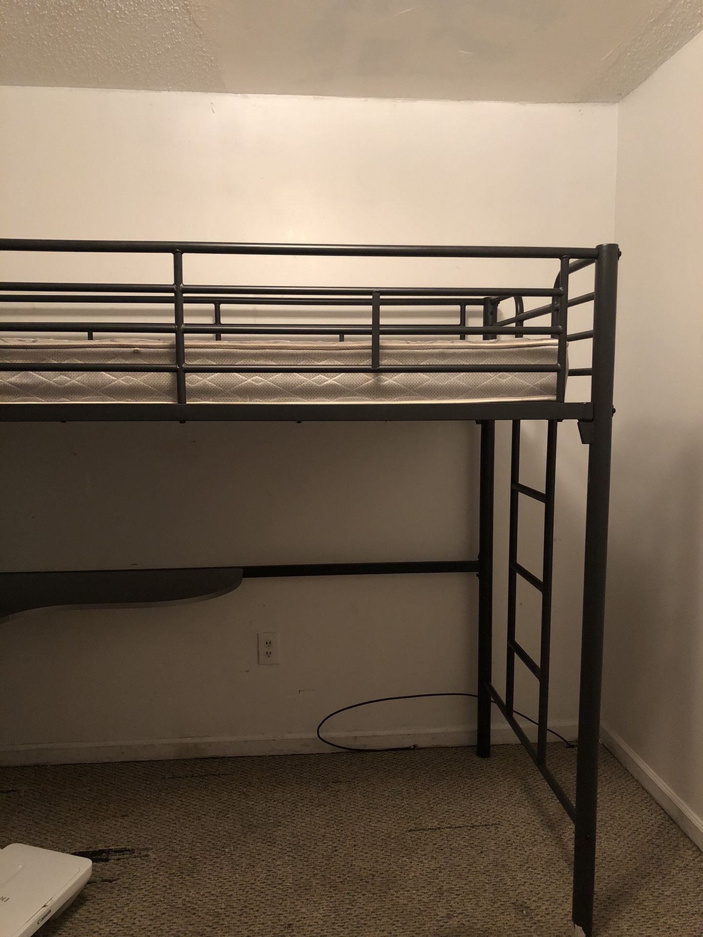 Twin bunk bed with a desk color black