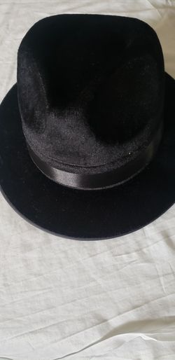 black velvet fedora features a matching satin band and a classic pinch-front crown