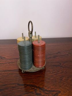 1920s poker chips in brass caddy