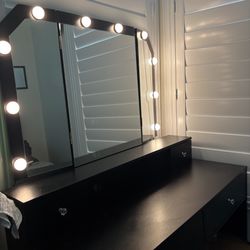 black vanity with hollywood style lights 