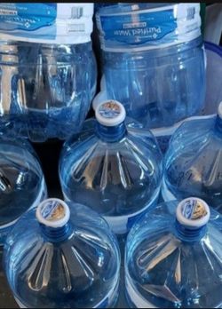 Empty plastic 4 gallon water bottles with lid 5 for $18.00 or $4 each