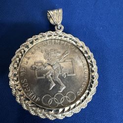 This is a 1968 Mexican 25 Pesos silver COIN XIX Olympic Games in Mexico City, mounted in a decorative sterling silver bezel for use 