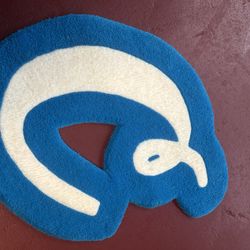 Hand-Tufted Rug is crafted to resemble a cookie ishape in blue and cream colors.  Excellent Condition. Clean, well cared for, Ready for pickup or ship