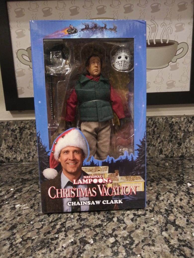 Clark Griswold: Christmas Vacation figure National Lampoons Christmas Vacation. Chainsaw Clark