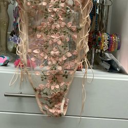 Valentine’s Day, Naughty But Nice, Beautiful Hand, Appliqué flowers, and netting. Size medium unworn.