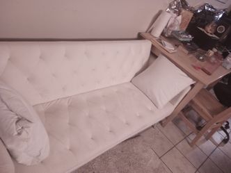 Luxurious tufted white sofa in excellent condition