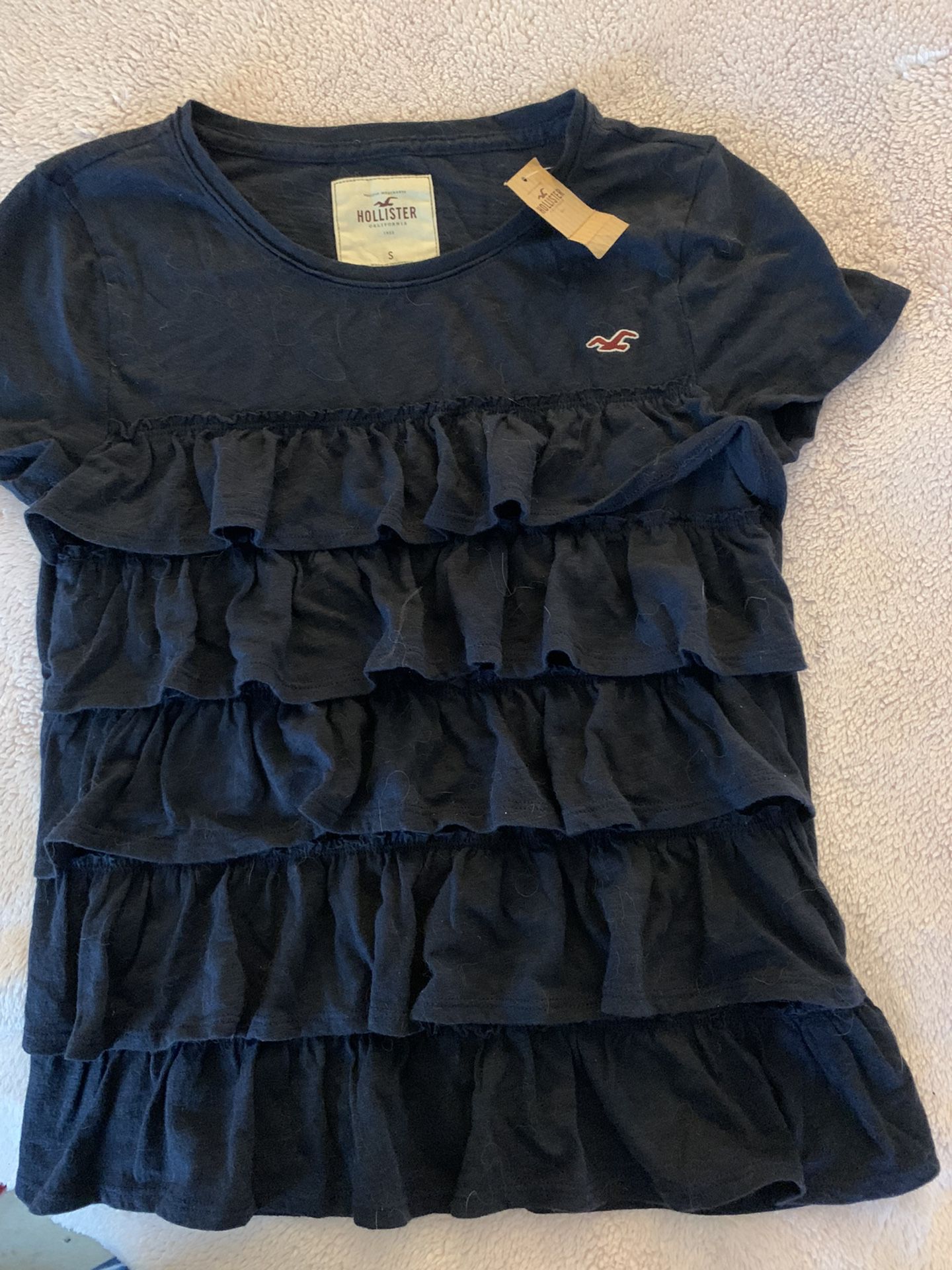 New lady small dark blue Hollister short sleeve with delicate ruffles in the front