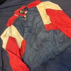 The Vintage Retro Starter Windbreaker Jacket in USA Olympic Colors is a stylish and nostalgic addition to any man's wardrobe. Made with durable nylon 