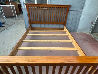 Solid wood queen bed frame in very good condition