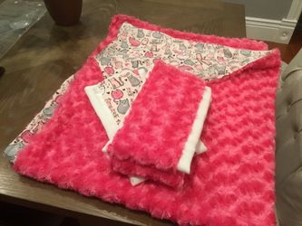 Homemade quilt w burp cloths to match.