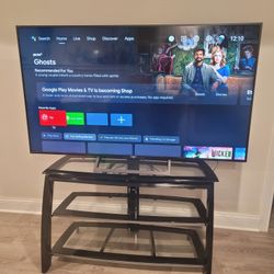 BEAUTIFUL TV STAND IN LIKE NEW CONDITION,  METAL FRAME WITH 3 GLASS SHELVES. IT MEASURES  ABOUT 45 WIDE BY 27 HIGH BY 15  DEEP. $80.00 OR BEST OFFER.