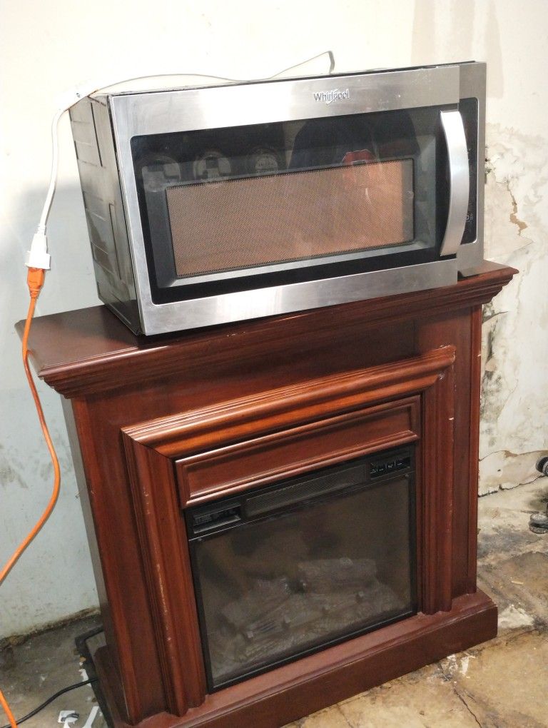 Whirlpool 1.7-cu ft 29.94 In Over The Range Microwave AND Beautiful Wooden Electric Fireplace (Dual Package)!!