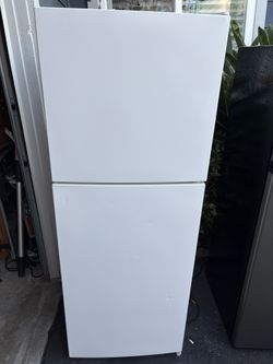 White Refrigerator 21 1/4”w by 22 1/4”d by 57 “h
