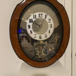 Small World Rhythm DWS Timecracker (Model 4MH752), a "Magic Motion" wall clock that features an animated display and hourly melodies.