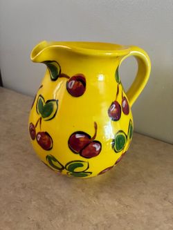 Yellow ceramic cherry pitcher