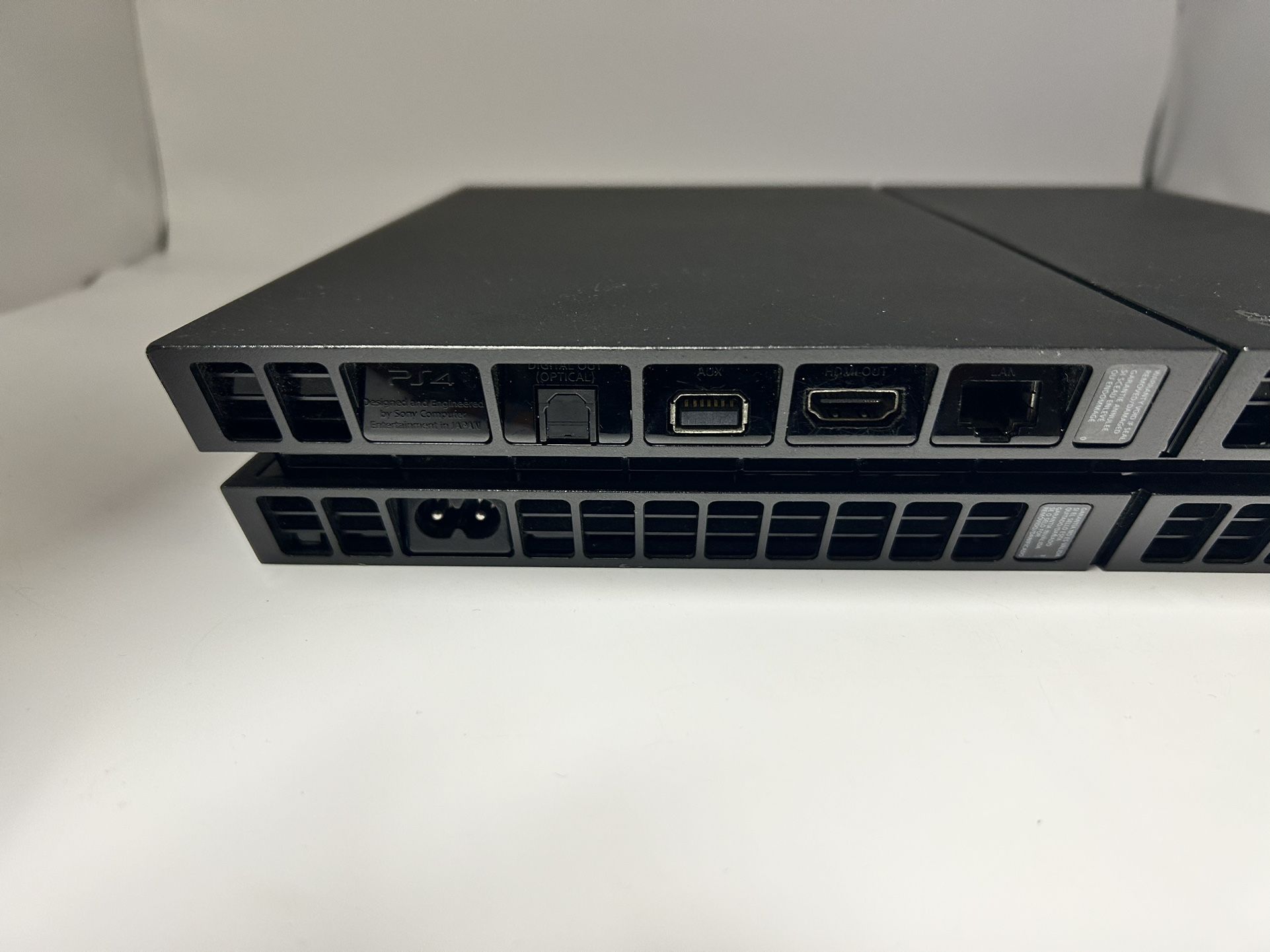 A PS4 Black Slim Console Including Game And Cords!