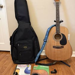 Guitar with Bag, strap, tuner, & books