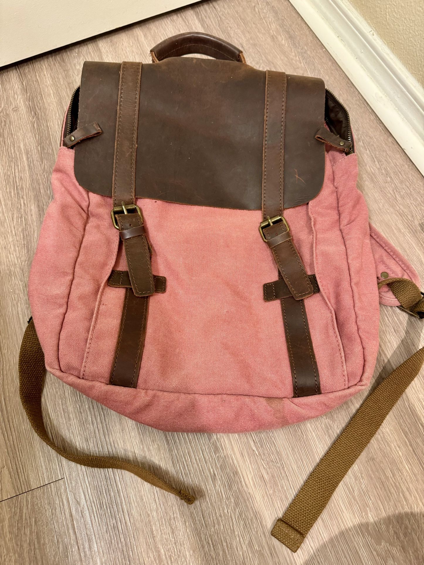 Pink and brown backpack with leather straps