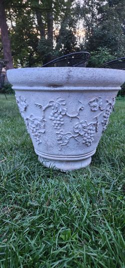 Heavy cast stone planter with design