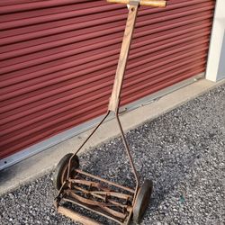 Vintage Reel Type push lawn clipper / mower.  Still works! Great decoration for yard or garden