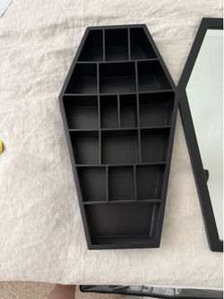Hanging coffin shelf for small items