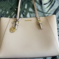 Michael Kors Saffiano leather tote in a blush/light pink color,