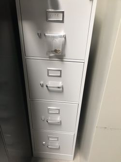 Vertical filing cabinet with keys