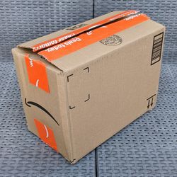 Clean small size cardboard box with foam peanuts for shipping moving or storage