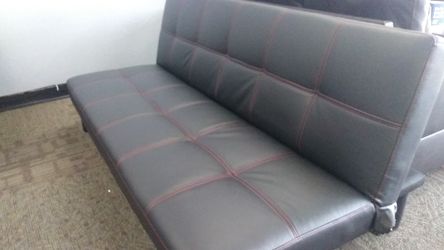 New black faux leather with red stitching futon