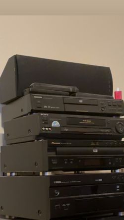 Multiple different DVD players including 3 remotes