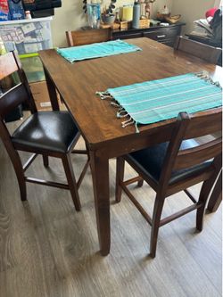 Solid Wood, Bar Height, Dining table with 4 bar height chairs.