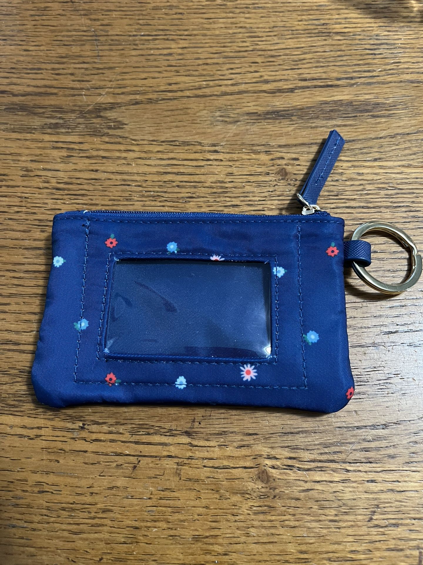 Blue Floral Getaway Travel Zip Wallet with ID Case Key Chain. Size appropriately 5 inches wide and 3 1/4 inches tall. Brand new never used.
