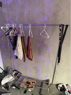 Rolling clothes rack with wheels