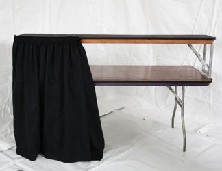 4 Foot Bar Table With SpeedRail Installed And Black Curtain