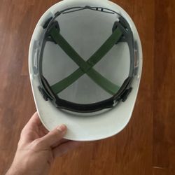 Hardhat with neon orange reflector vest