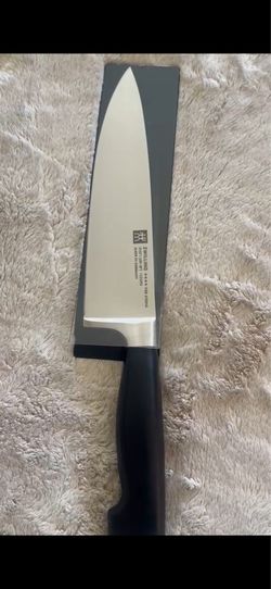 Brand new, never used ZWILLING Four Star (Vier Sterne) 8-inch Chef’s Knife. Made in Germany with premium