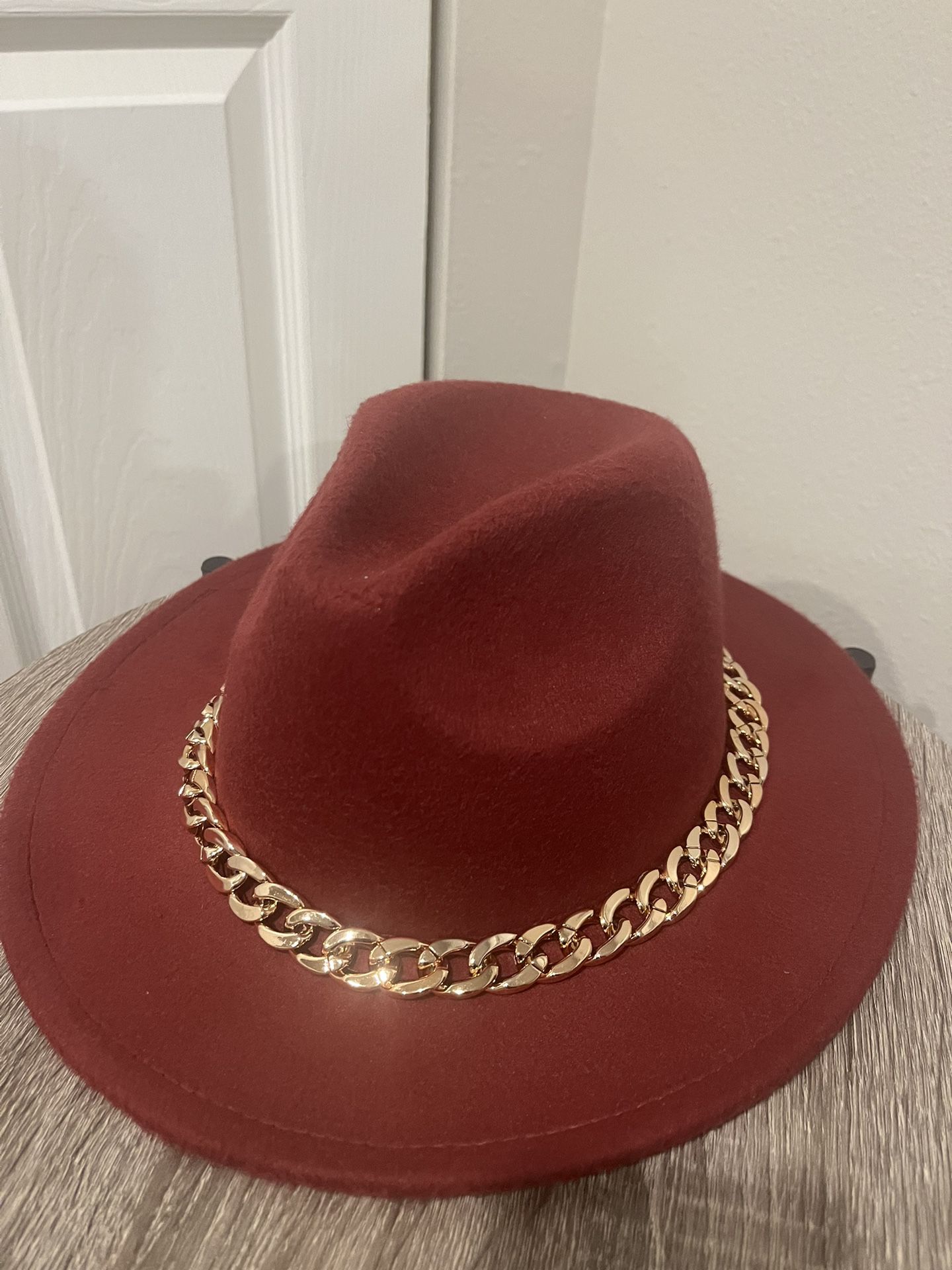 A dark red cowgirl Hat 