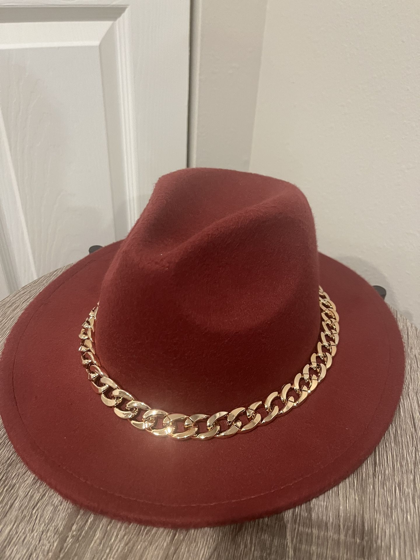 A dark red cowgirl Hat