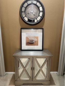 Mirrored Cabinet, Art, and Clock