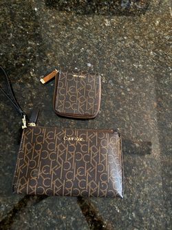 CK wristlet and a matching zip wallet
