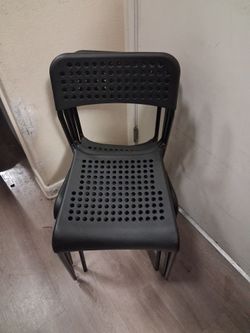 Black Plastic Stackable Chair with Perforated Seat