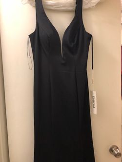 Beautiful long evening dress. Knock out looking dress for that great event. Prom.....wedding.....or any occasion. Brand new....never has been worn.