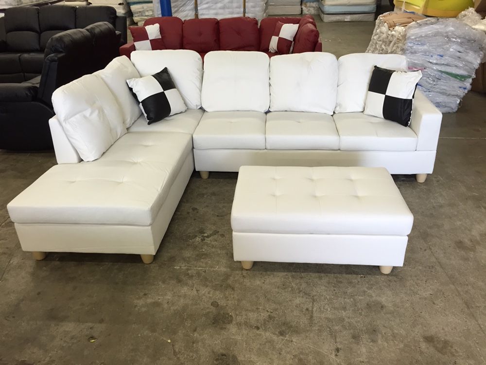 New White Leather Sectional Sofa With Storage Ottoman And Pillows
