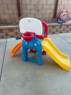 Slide for kids with steps and basketball hoop
