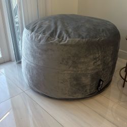 This is a Somnia velvet bean bag chair in a gray color