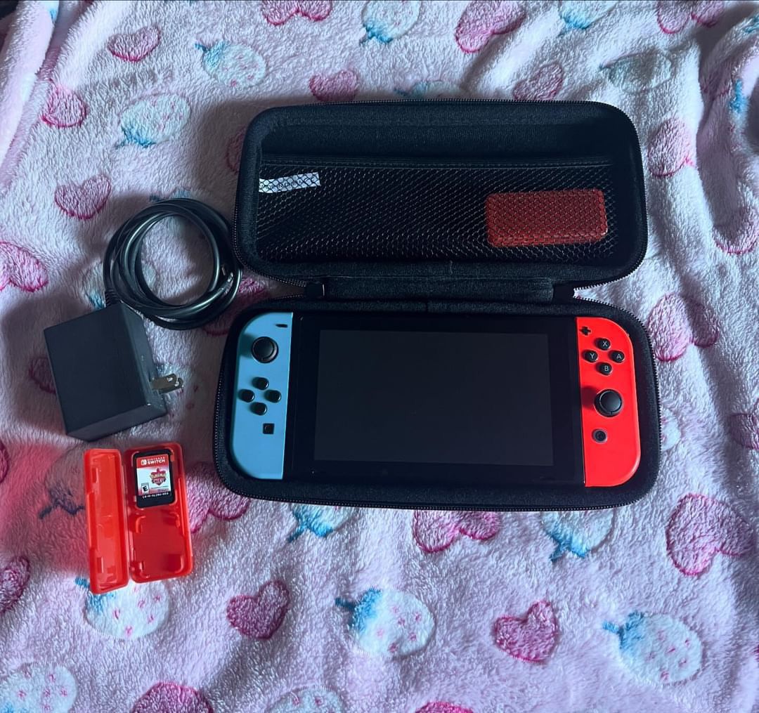 Nintendo Switch with case, game, and charger