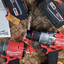 MILWAUKEE  M18 FUEL  18-VOLT LITHIUM ION  BRUSHLESS CORDLESS GEN-4  HAMMER DRILL AND IMPACT DRIVER  WITH TWO HIGH CAPACITY  5.0AH BATTERIES  AND CHARG