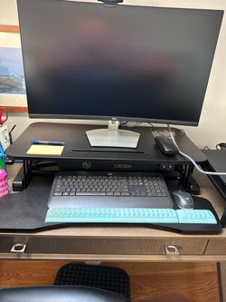 Electric stand up desk converter