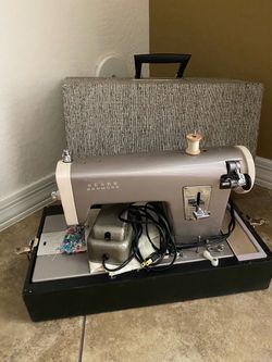 Vintage sewing machine and accessories-$100-higley and ray.