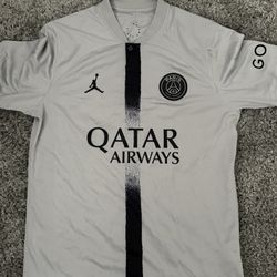 This is a Nike Jordan Paris Saint-Germain 2022/23 away stadium jersey in light smoke grey